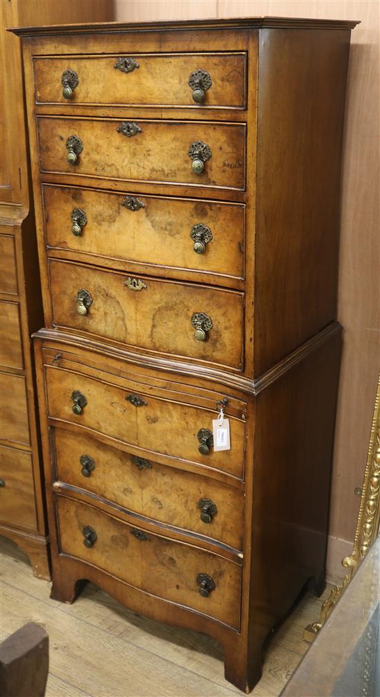 A Georgian style walnut chest on chest of serpentine form W.63cm